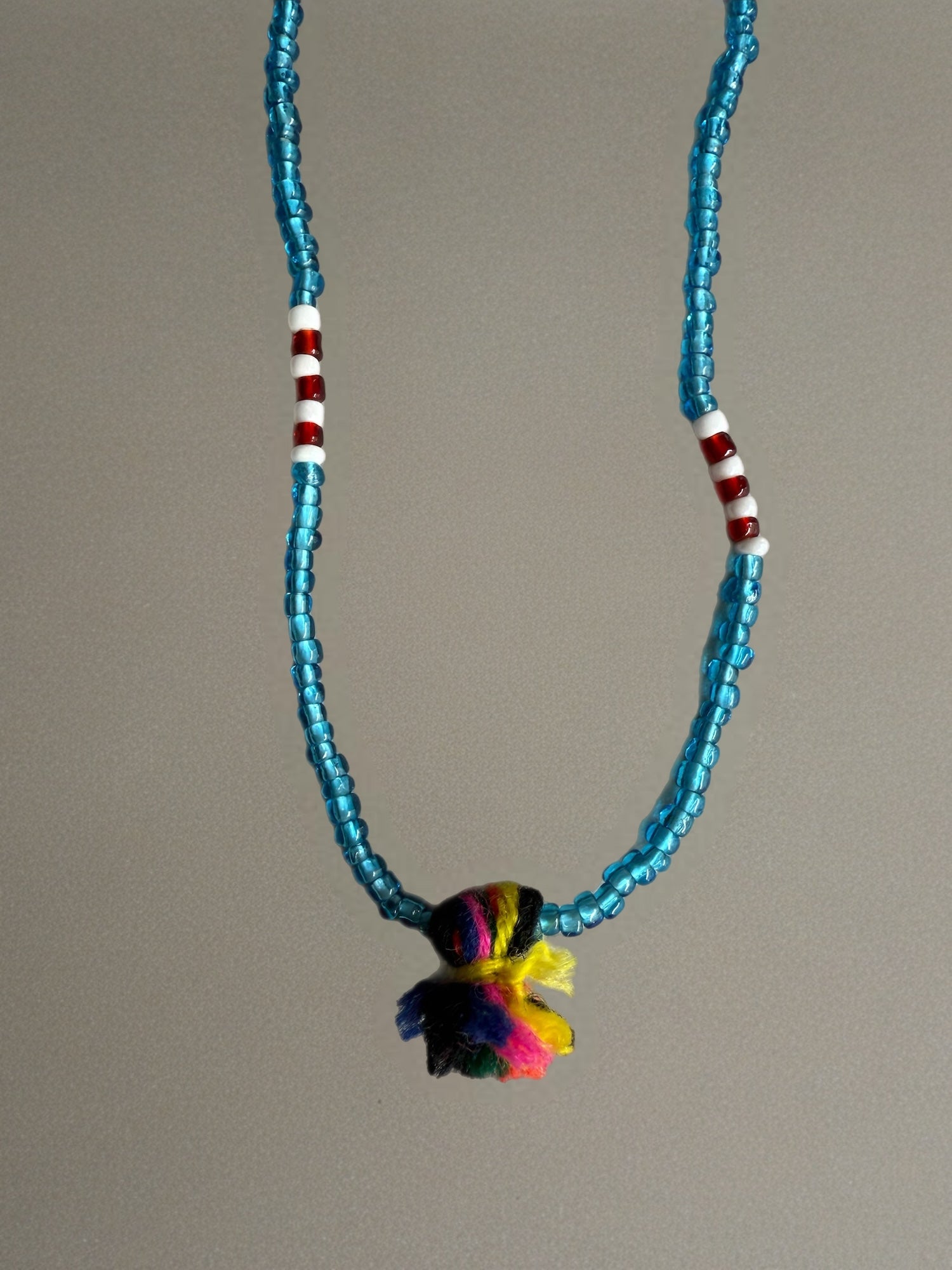 Shanti Necklace - Light Blue with Multicolor Pompom