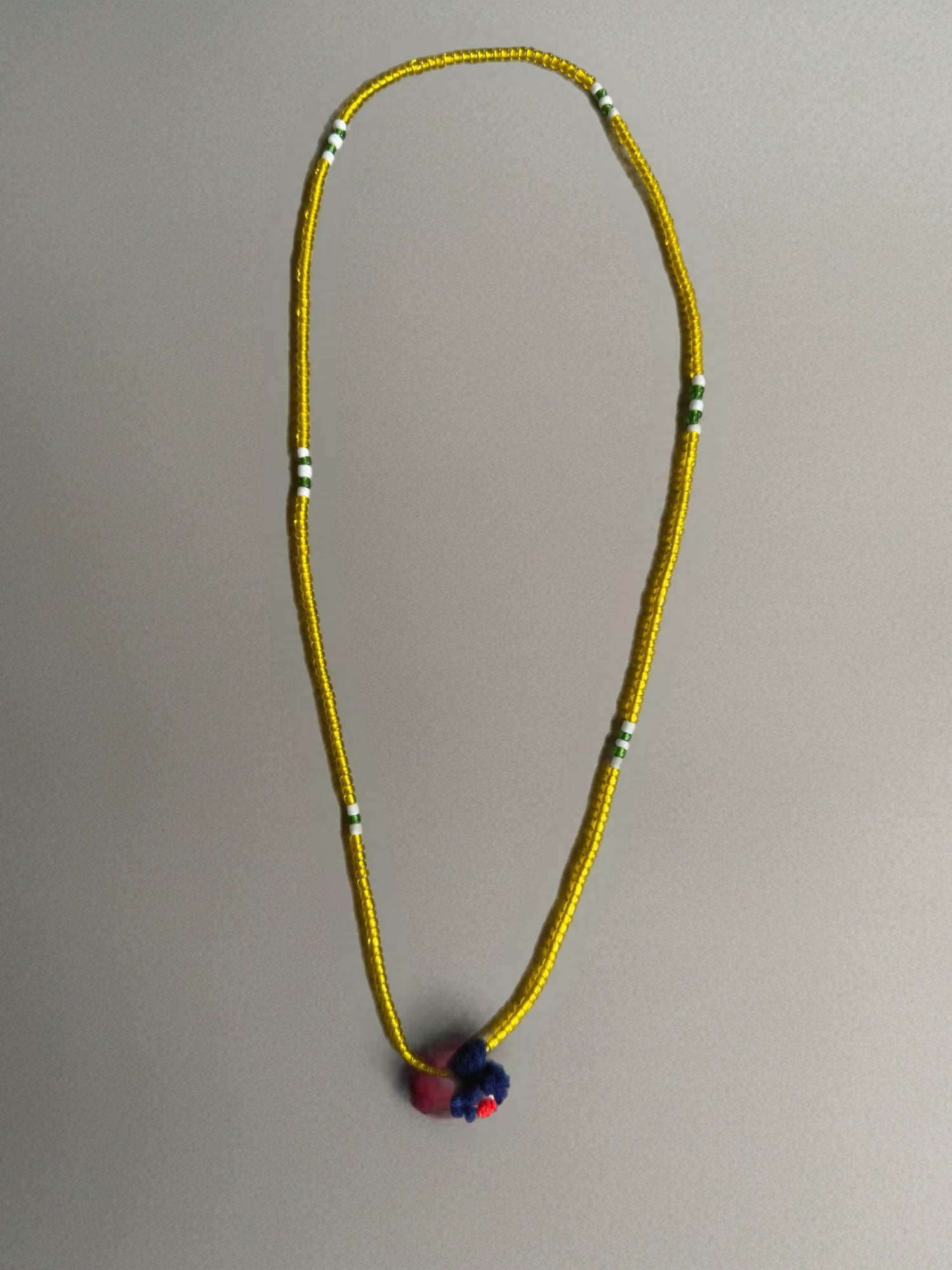 Shanti Necklace - Yellow with Blue Pompom