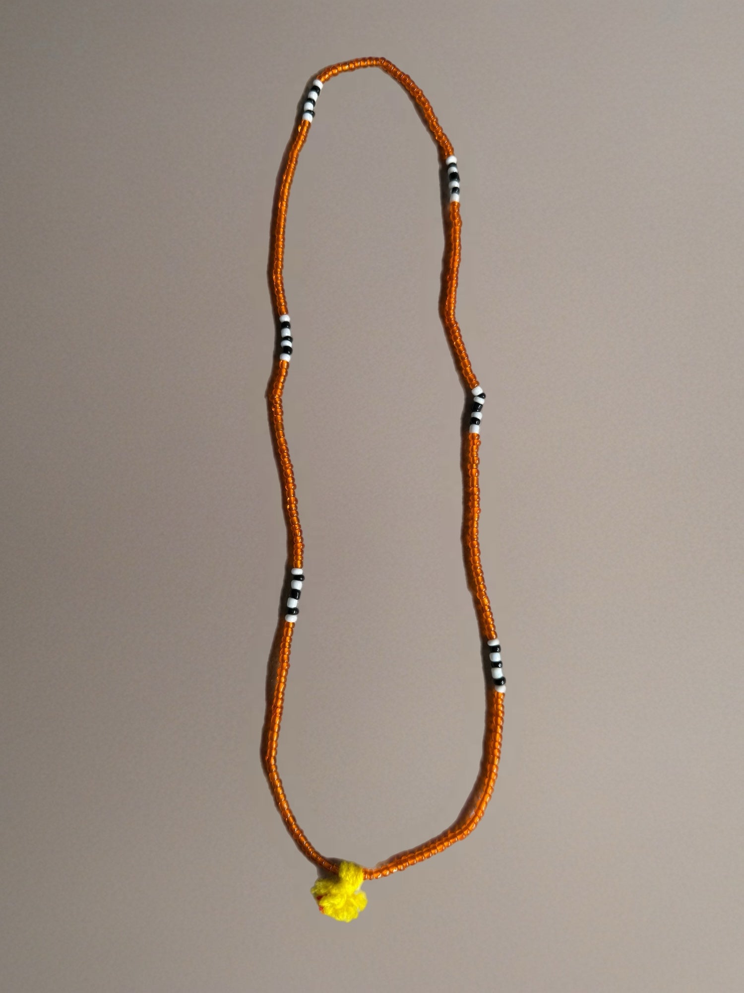 Shanti Necklace - Orange with Yellow Pompom