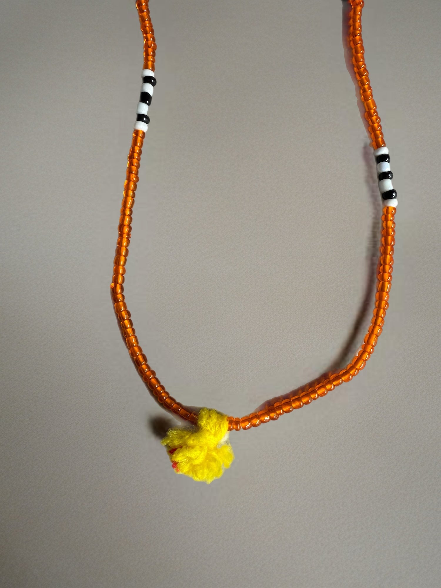 Shanti Necklace - Orange with Yellow Pompom