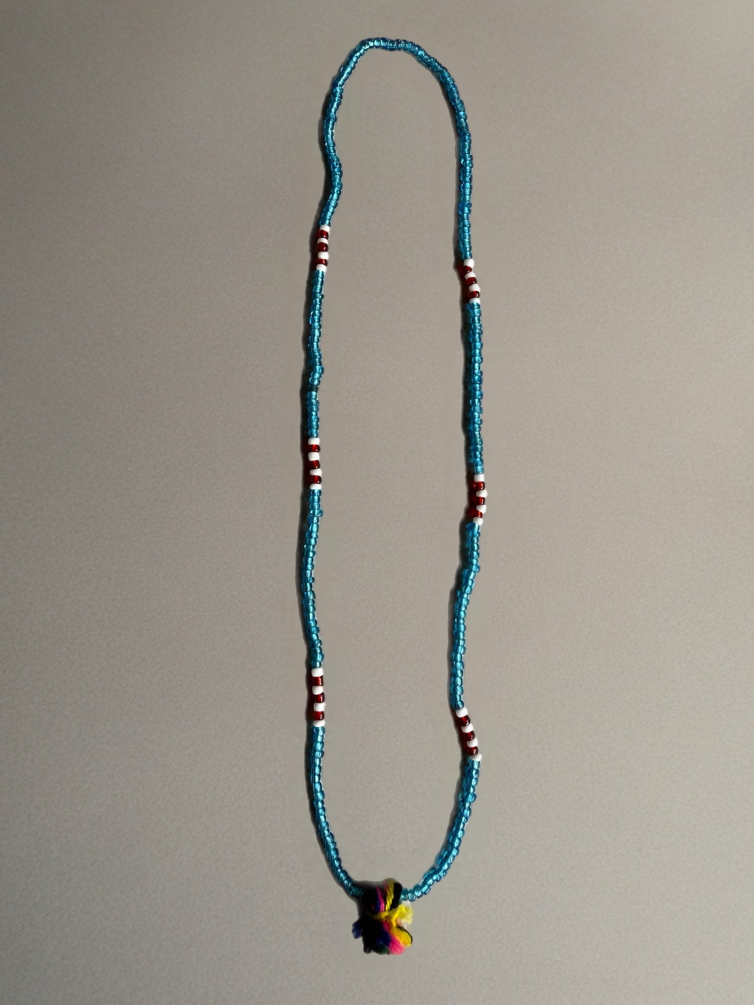 Shanti Necklace - Light Blue with Multicolor Pompom